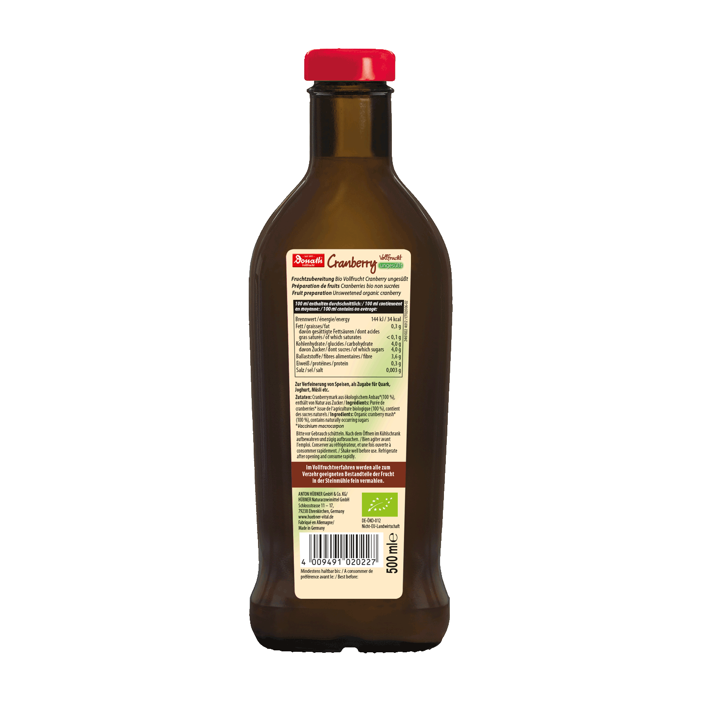 Eine braune Glasflasche mit rotem Deckel, auf deren Rückseite das Etikett mit Nährwertangaben und Zutaten zu sehen ist.