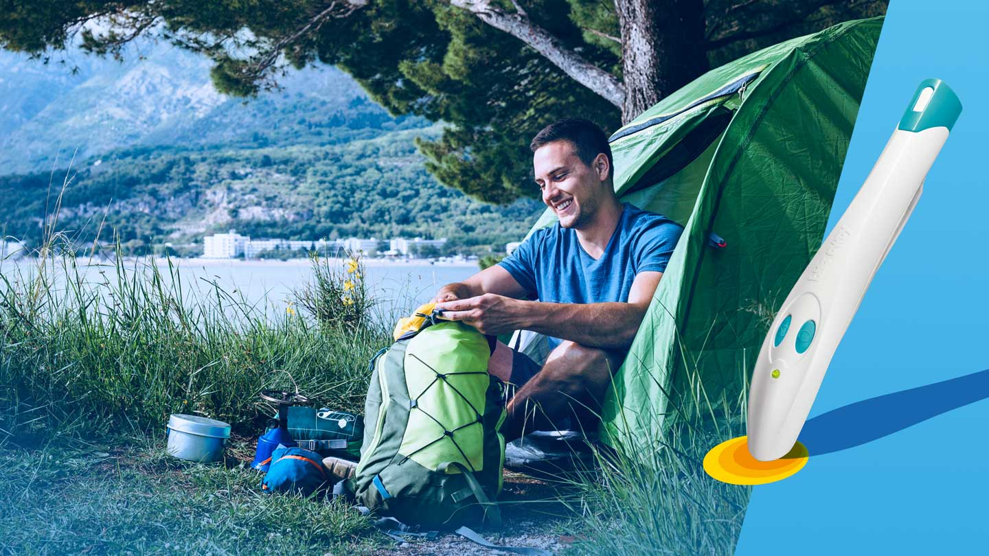 Ein Mann hock an einem See beim Camping und es ist das Produktbild des bite away Cobra mit darauf zu sehen.